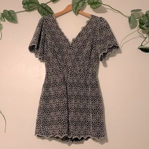 Express black and white eyelet embroidered romper with scalloped hem